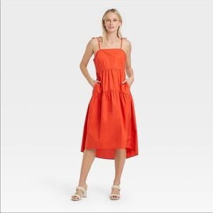 Red midi dress with tie spaghetti straps and pockets